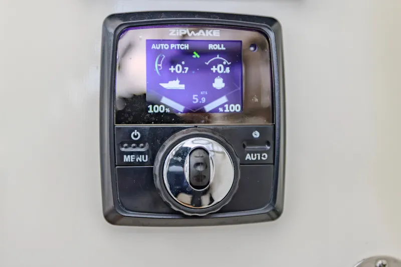 Slide: The Image of Zipwake control panel on 2021 Brooklin Boat Yard 32 Express, displaying auto pitch and roll settings. - 17