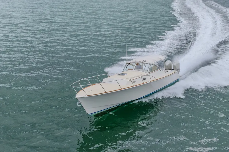 Slide: The Image of Brooklin Boat Yard 32 Express 2021 cruising on open water, creating a dynamic wake. - 36
