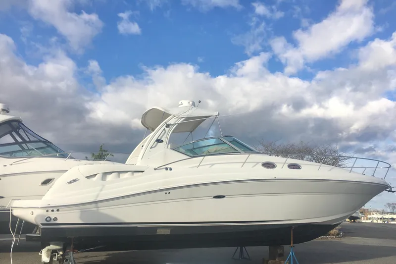 The Image of 2007 Sea Ray 340 Sundancer yacht under a cloudy blue sky. - 0