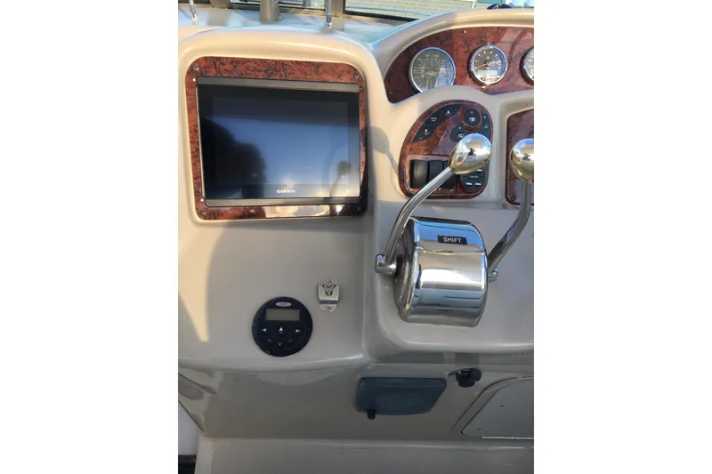 Slide: The Image of 2007 Sea Ray 340 Sundancer dashboard with Garmin display and control panel. - 10