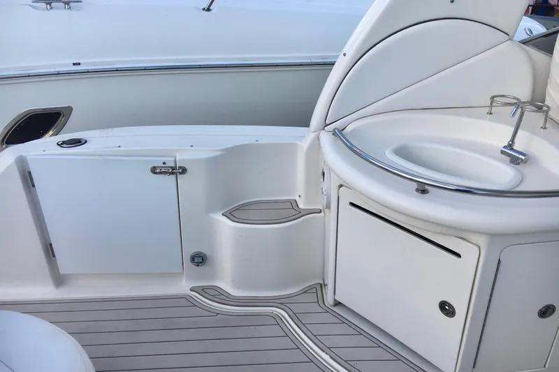 Slide: The Image of 2007 Sea Ray 340 Sundancer boat interior with sink and storage compartments. - 14