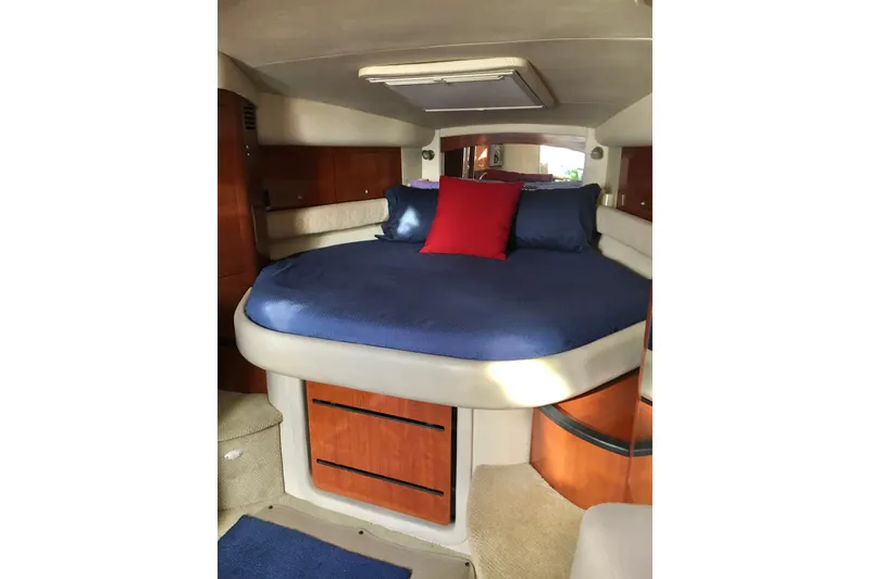 Slide: The Image of Luxurious cabin interior of 2007 Sea Ray 340 Sundancer with cozy bed and elegant wood finish. - 22