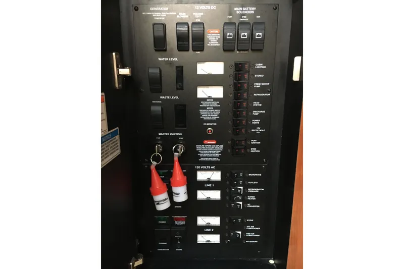 Slide: The Image of Electrical control panel of a 2007 Sea Ray 340 Sundancer boat, featuring various switches and indicators. - 28