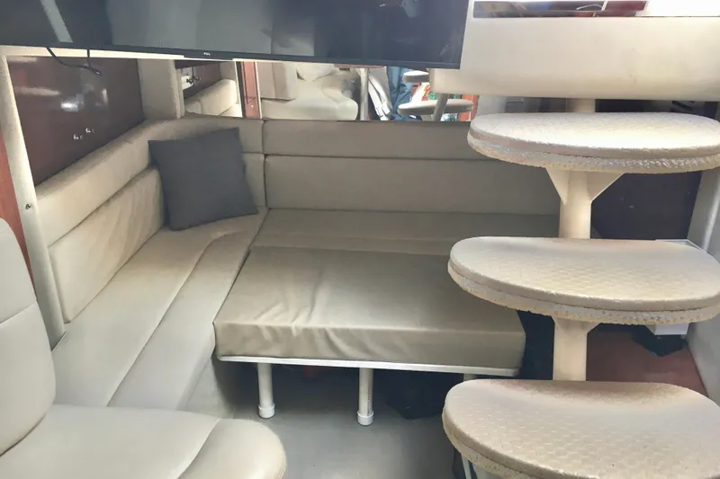 Slide: The Image of Interior of 2007 Sea Ray 340 Sundancer with beige seating and spiral staircase. - 29