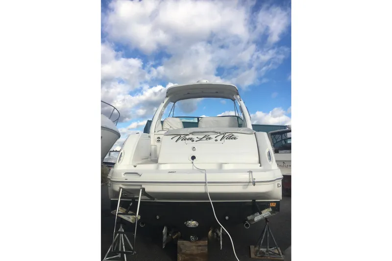 Slide: The Image of 2007 Sea Ray 340 Sundancer yacht on stands under a cloudy sky. - 3