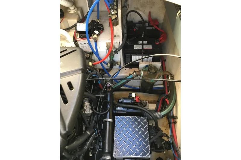 Slide: The Image of Engine compartment of 2007 Sea Ray 340 Sundancer with visible wiring and components. - 35