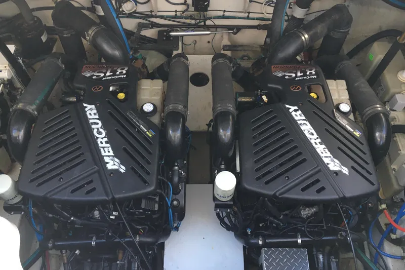 Slide: The Image of Twin Mercury engines in a 2007 Sea Ray 340 Sundancer boat engine compartment. - 37