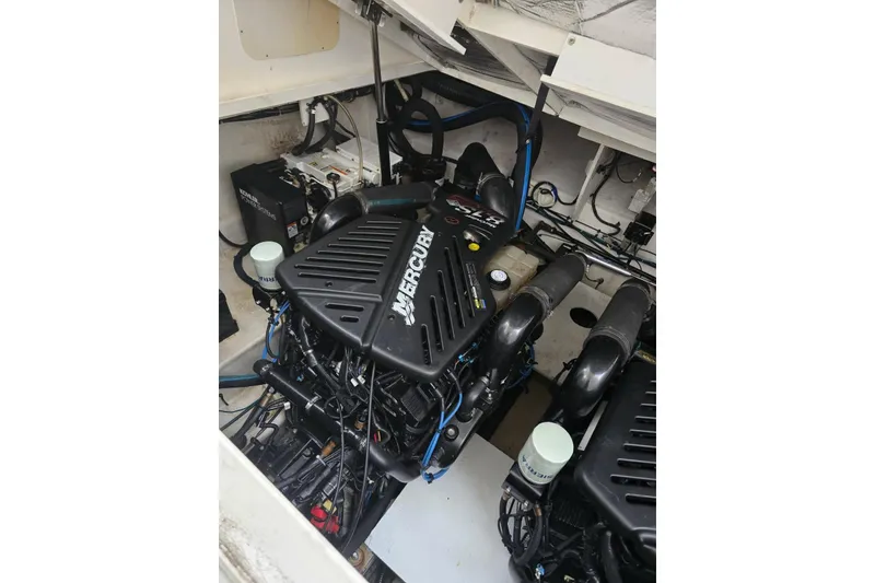 Slide: The Image of Engine compartment of a 2007 Sea Ray 340 Sundancer with Mercury engines. - 38