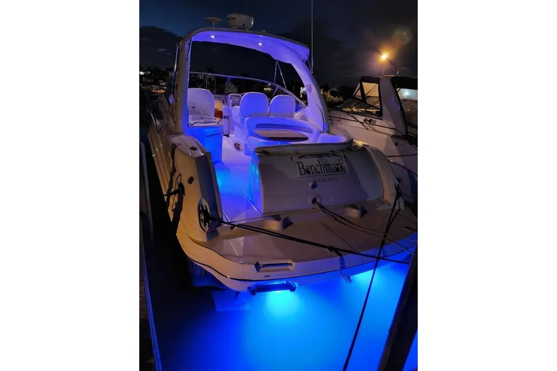 Slide: The Image of 2007 Sea Ray 340 Sundancer yacht with blue underwater lights at night. - 40