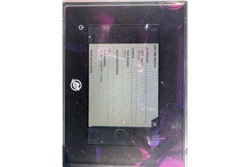 Slide: The Image of Display screen showing fuel economy and engine statistics for 2024 Andros Tarpon 26. - 10