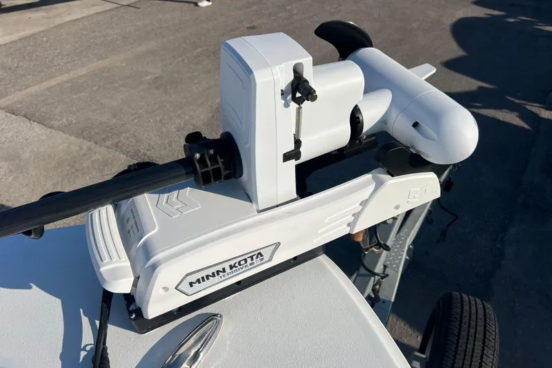 Slide: The Image of Minn Kota trolling motor on 2024 Andros Tarpon 26 boat, parked on pavement. - 17