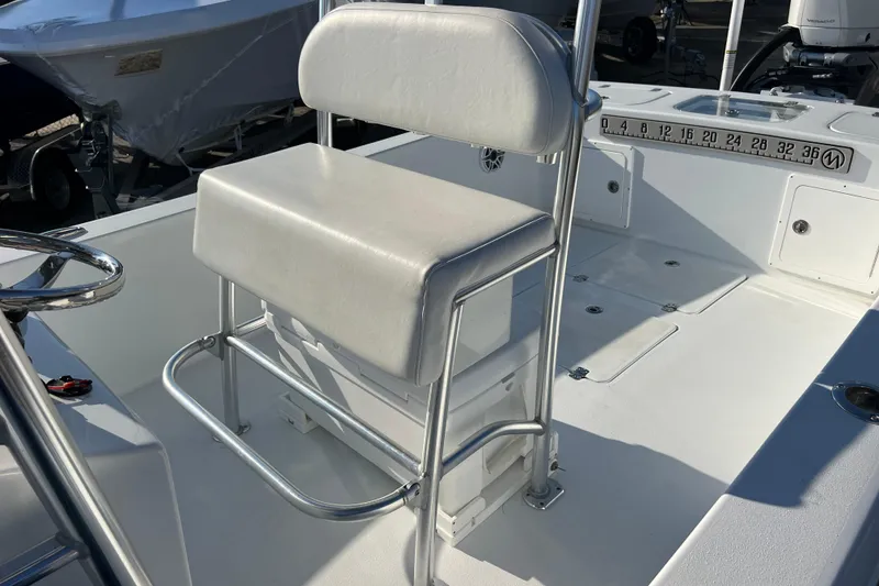 Slide: The Image of 2024 Andros Tarpon 26 boat interior with white seating and stainless steel frame. - 25