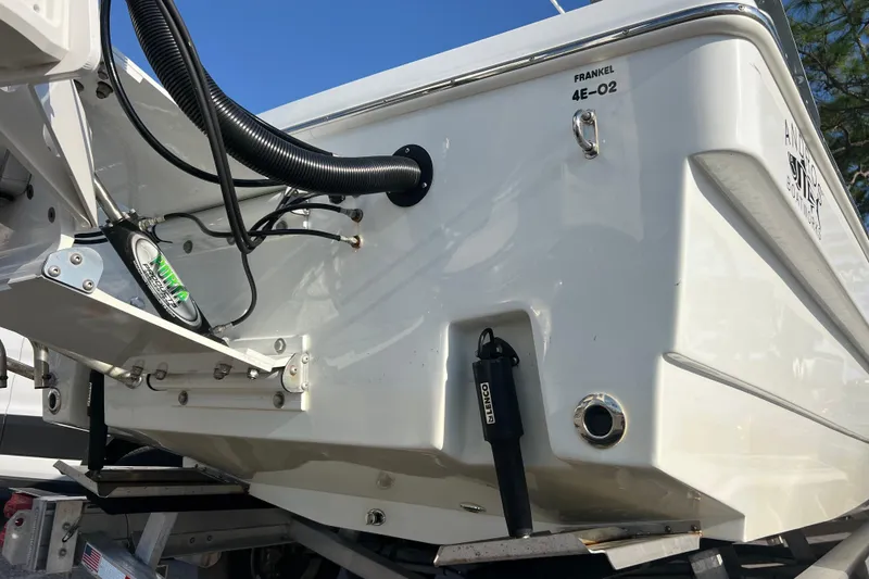 Slide: The Image of 2024 Andros Tarpon 26 boat stern with hydraulic components and sleek design. - 8