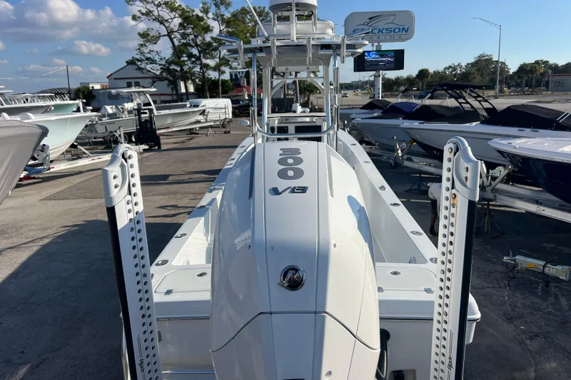 Slide: The Image of 2024 Andros Tarpon 26 boat displayed at a marina, featuring a powerful engine. - 9