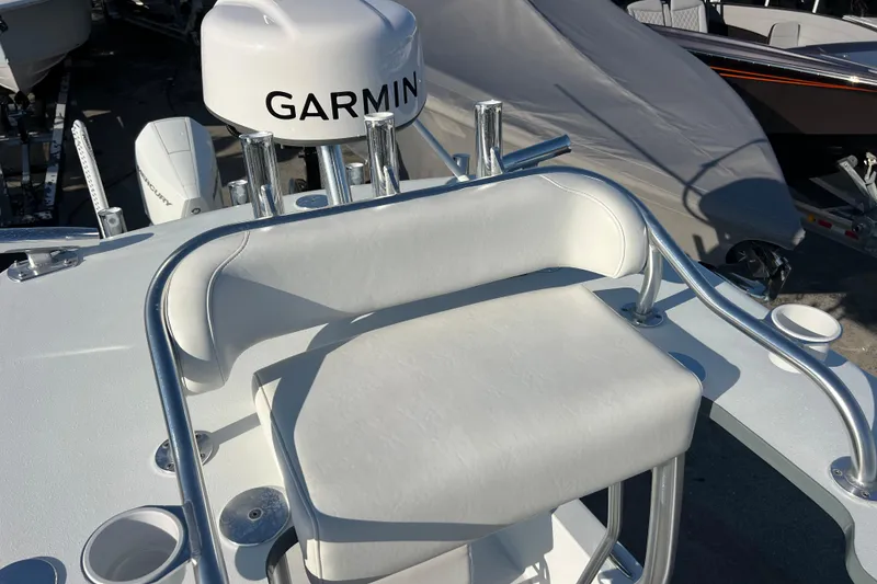 Slide: The Image of 2024 Andros Tarpon 26 boat with Garmin equipment and cushioned seating. - 24