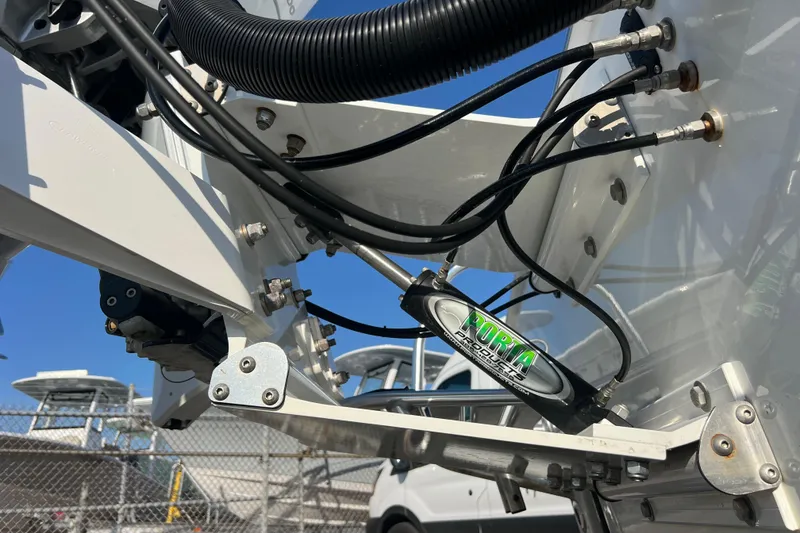 Slide: The Image of Close-up of 2024 Andros Tarpon 26 boat's hydraulic steering system and cables. - 7