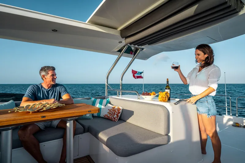 Slide: The Image of Couple enjoying leisure time on 2026 Beneteau Swift Trawler 48 yacht. - 21