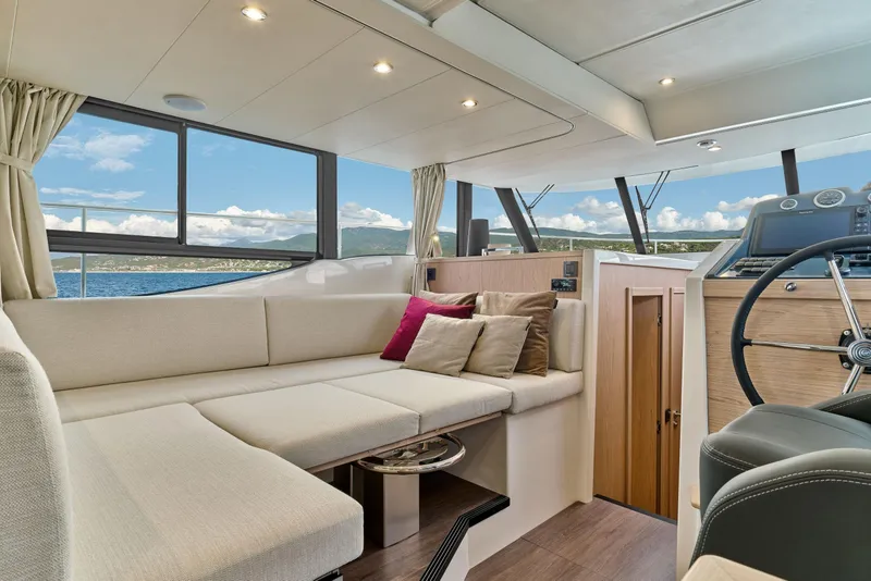 Slide: The Image of Luxurious interior of 2026 Beneteau Swift Trawler 48 with plush seating and scenic views. - 27