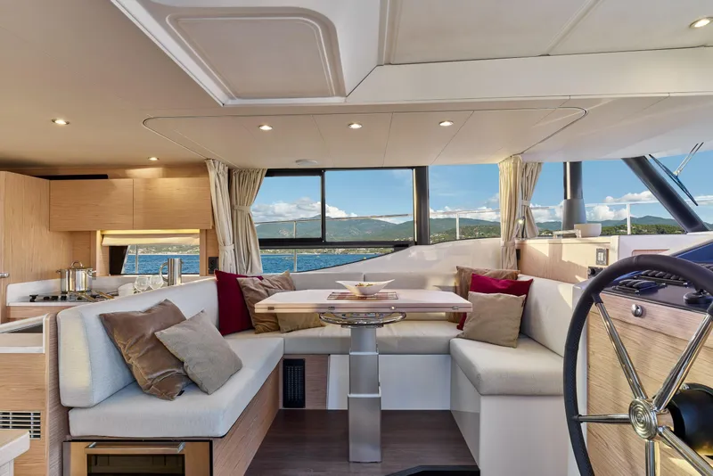 Slide: The Image of Luxurious interior of 2026 Beneteau Swift Trawler 48 with scenic ocean view. - 36