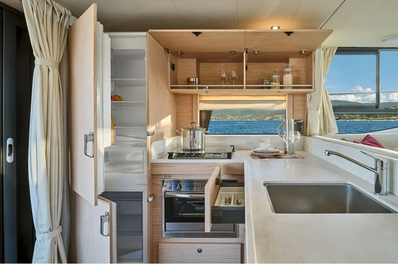Slide: The Image of Modern kitchen interior of 2026 Beneteau Swift Trawler 48 with ocean view. - 43