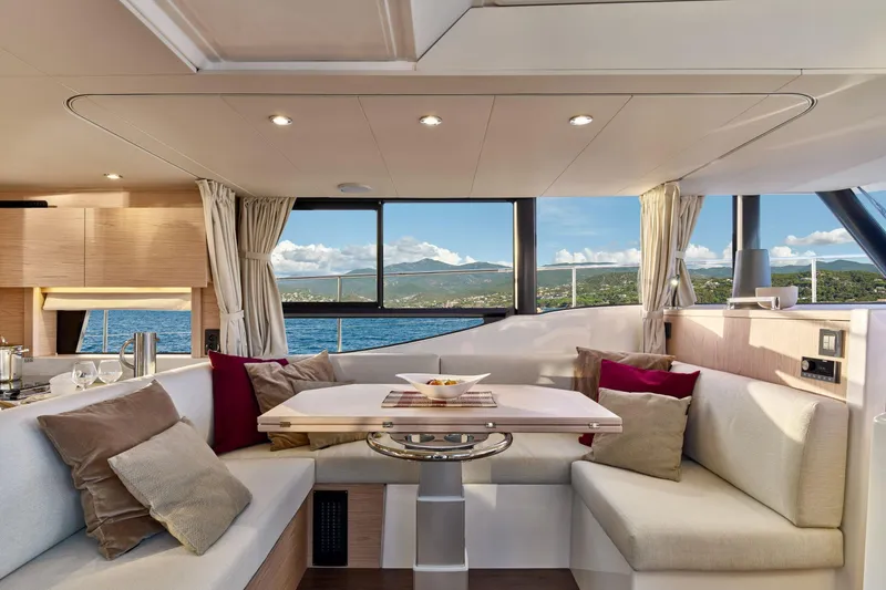 Slide: The Image of Luxurious interior of 2026 Beneteau Swift Trawler 48 with scenic ocean view. - 9