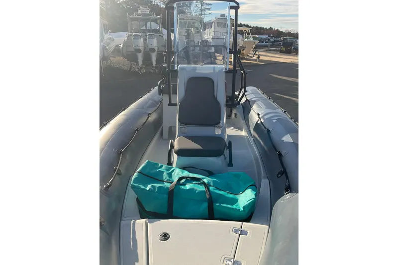 Slide: The Image of 2020 Zodiac Pro 5.5 boat interior with teal bag on deck. - 6
