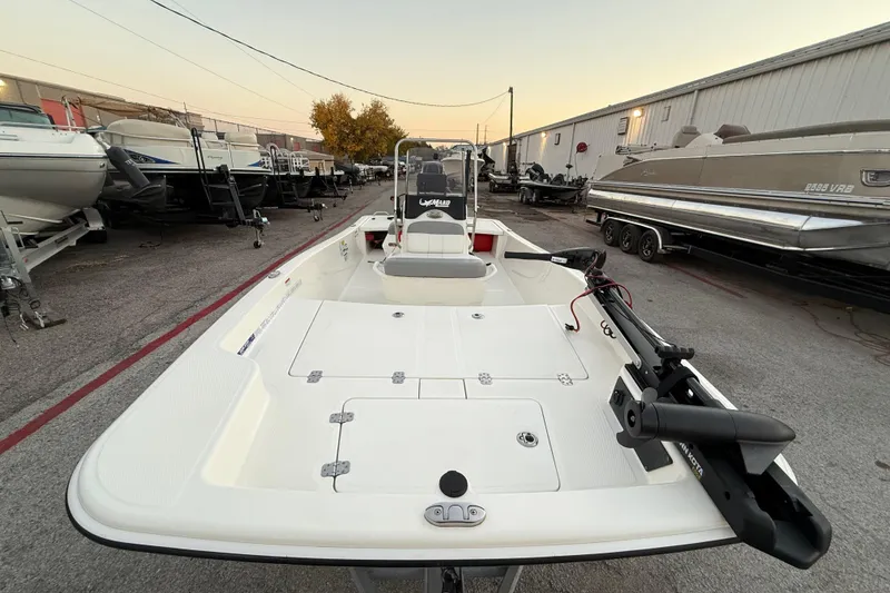 Slide: The Image of 2023 Mako Pro Skiff 15 CC boat on trailer, parked outdoors. - 19