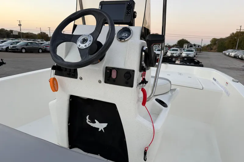 Slide: The Image of 2023 Mako Pro Skiff 15 CC boat interior with gray and white seating. - 27