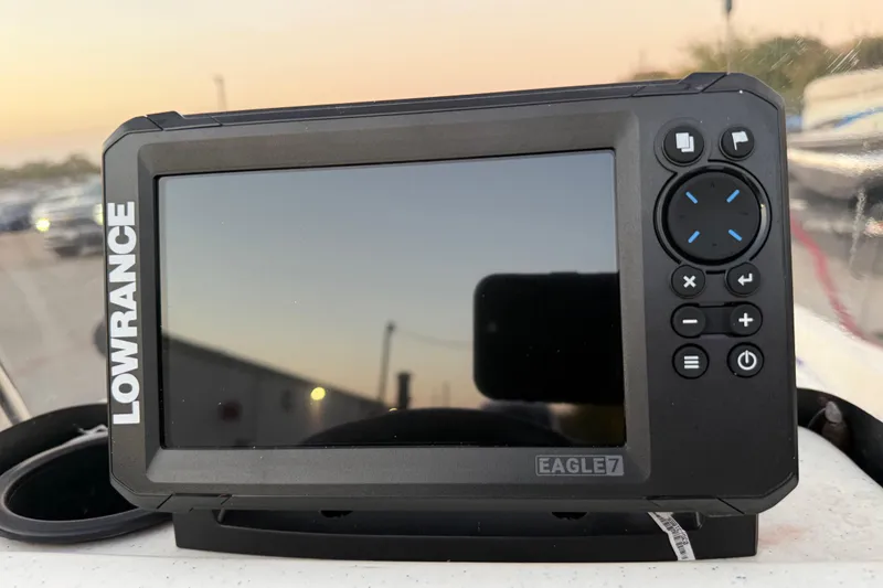 Slide: The Image of 2023 Mako Pro Skiff 15 CC boat console with steering wheel and control panel. - 28