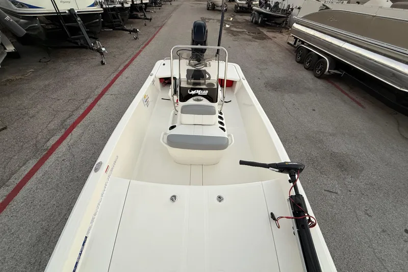 Slide: The Image of 2023 Mako Pro Skiff 15 CC boat seat with open storage compartment. - 31