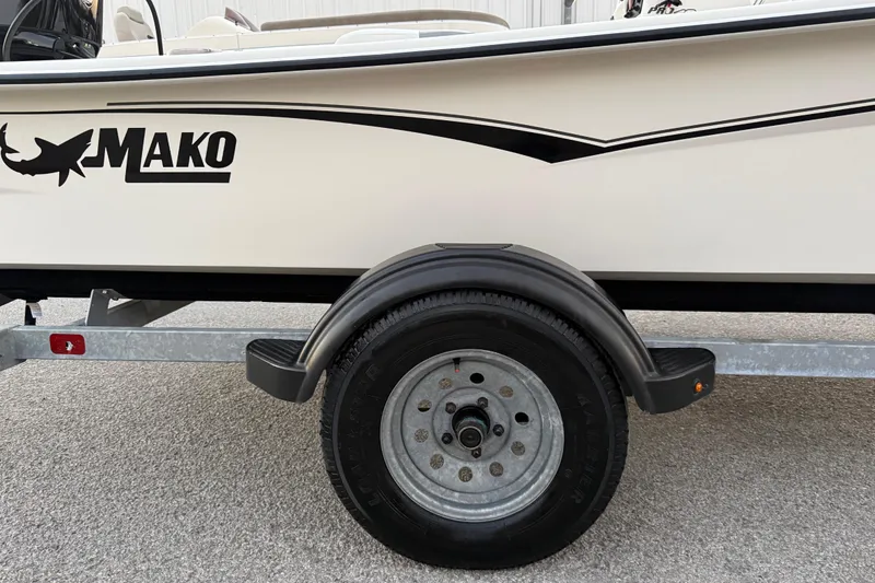 Slide: The Image of Close-up of a tire on a 2023 Mako Pro Skiff 15 CC trailer. - 50