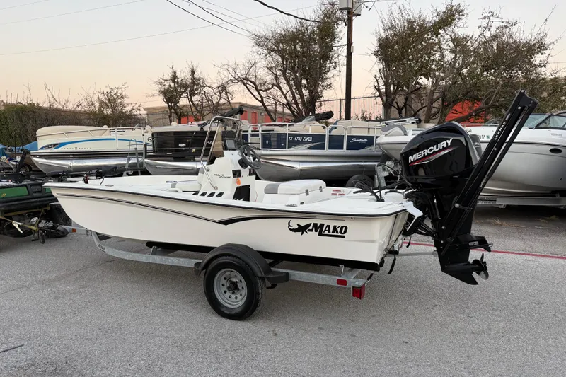 Slide: The Image of 2023 Mako Pro Skiff 15 CC boat on trailer, parked outdoors. - 6