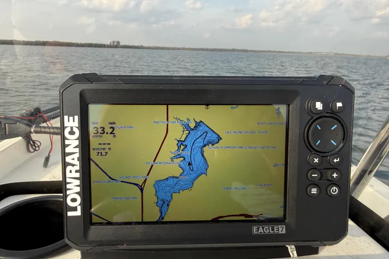 Slide: The Image of Fishfinder display on 2023 Mako Pro Skiff 15 CC, showing depth and water temperature. - 77