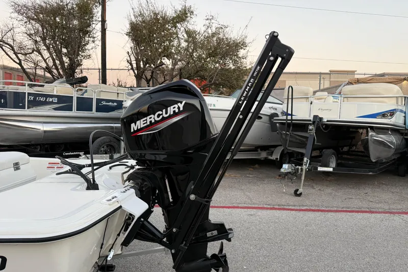 Slide: The Image of 2023 Mako Pro Skiff 15 CC with Lewmar Vector, Mercury engine in background. - 9