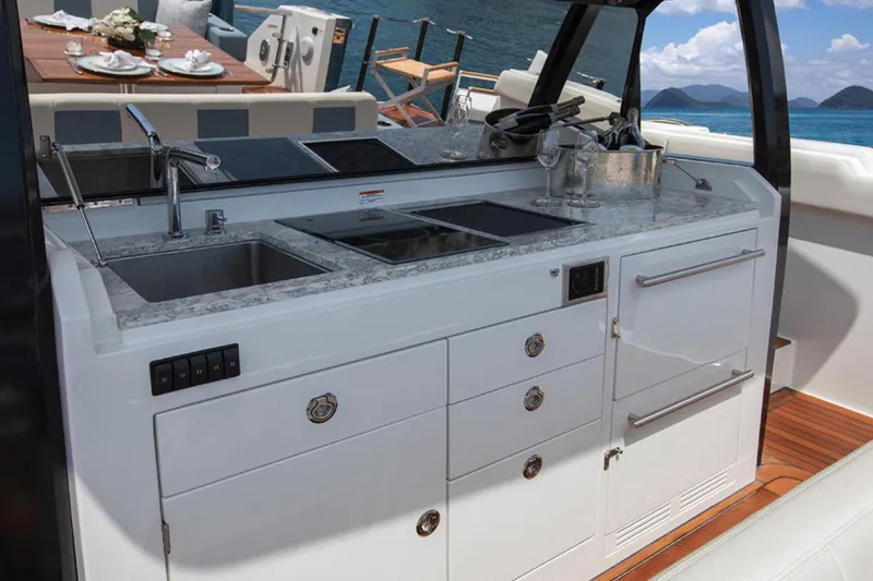 Slide: The Image of Manufacturer Provided Image: Outdoor kitchen on 2020 Ocean Alexander 45 Divergence Sport yacht with ocean view. - 16