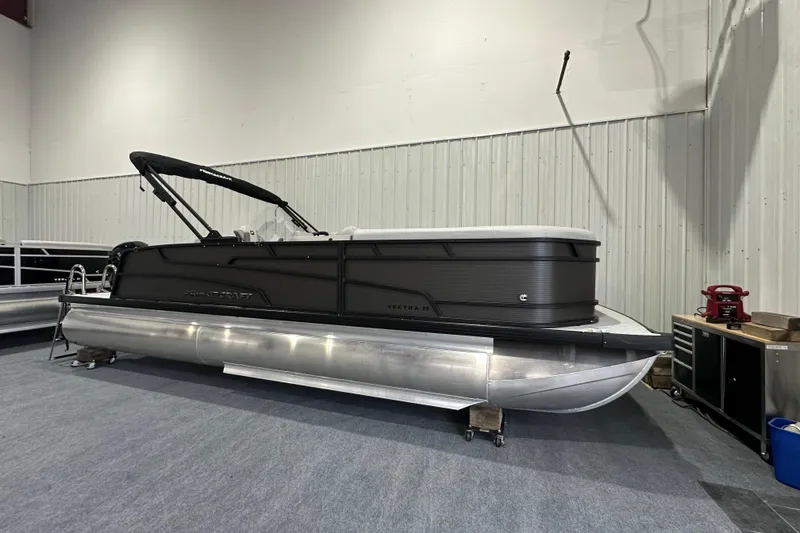 The Image of 2026 Princecraft Vectra 23 RL pontoon boat in showroom, side view. - 1