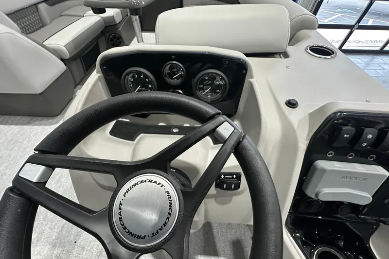 Slide: The Image of Steering console of 2026 Princecraft Vectra 23 RL pontoon boat with gauges and controls. - 11
