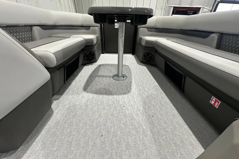 Slide: The Image of 2026 Princecraft Vectra 23 RL interior with gray seating and central table. - 12