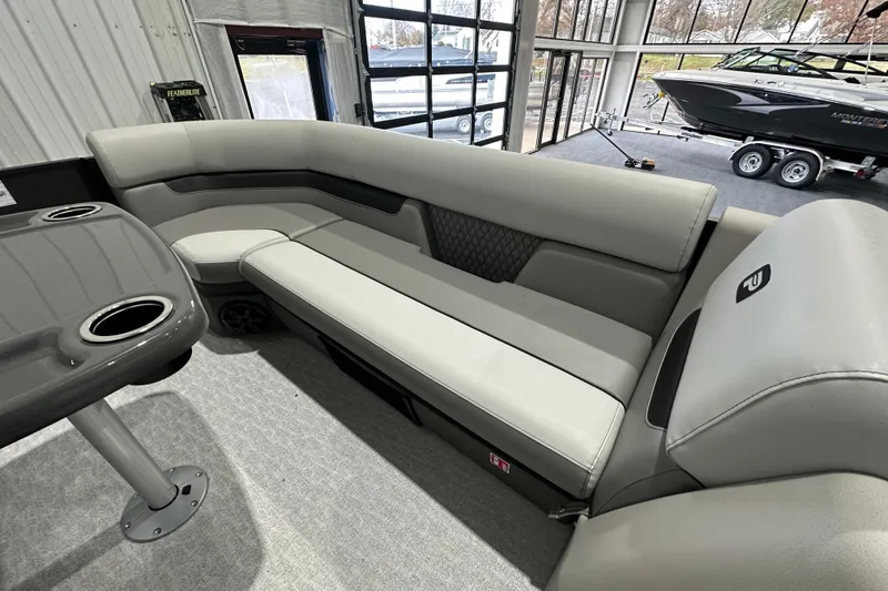 Slide: The Image of 2026 Princecraft Vectra 23 RL pontoon boat interior with gray seating and table. - 13