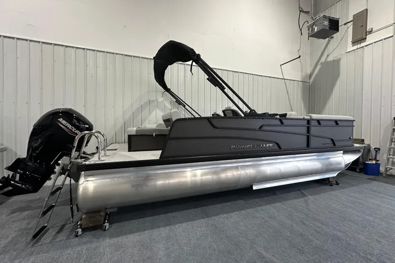 Slide: The Image of 2026 Princecraft Vectra 23 RL pontoon boat in showroom, featuring Mercury outboard motor. - 3