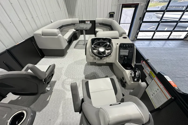Slide: The Image of 2026 Princecraft Vectra 23 RL pontoon boat interior with modern seating and steering console. - 8