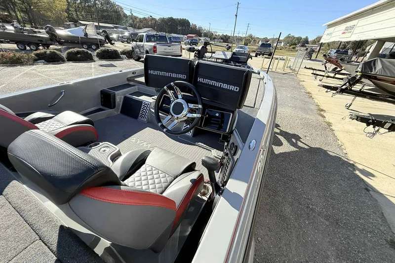 Slide: The Image of 2022 Caymas CX20PRO boat interior with steering wheel and Humminbird electronics. - 11