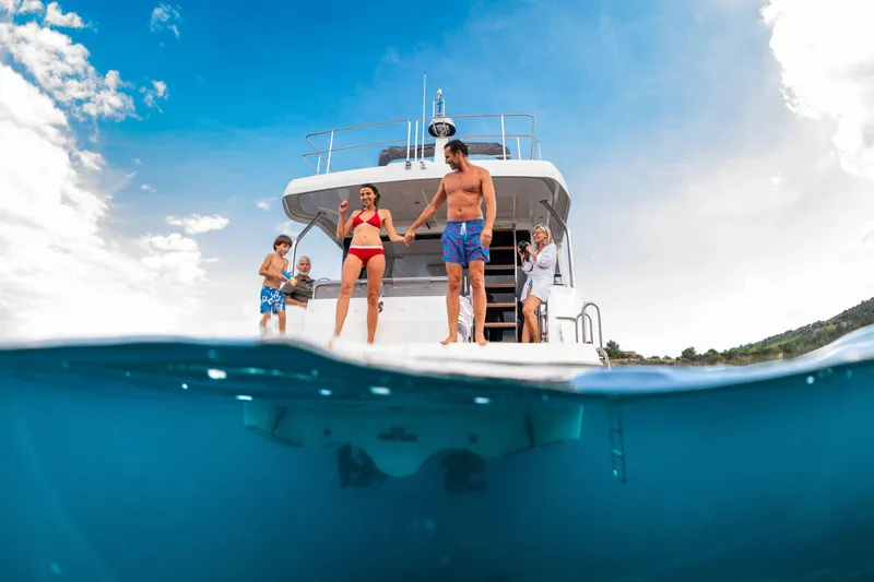 Slide: The Image of Family enjoying a day on a 2026 Beneteau Swift Trawler 41 Fly yacht. - 24