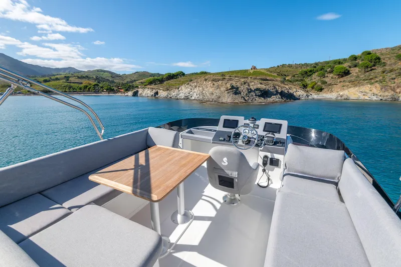 Slide: The Image of 2026 Beneteau Swift Trawler 41 Fly, scenic coastal view from flybridge. - 32