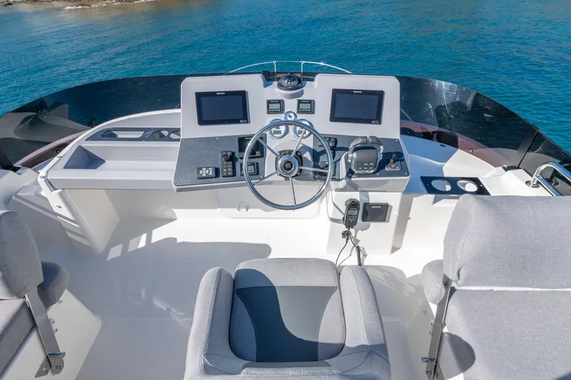 Slide: The Image of 2026 Beneteau Swift Trawler 41 Fly helm station with modern navigation equipment. - 33