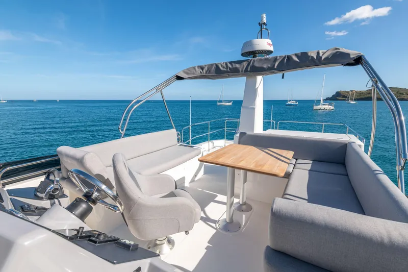 Slide: The Image of 2026 Beneteau Swift Trawler 41 Fly, spacious flybridge with seating, ocean view. - 34