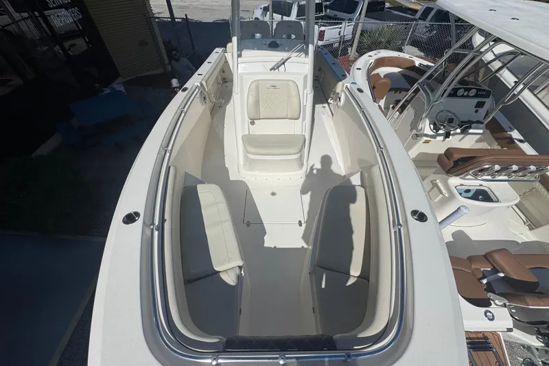 Slide: The Image of 2021 Cobia 262 Center Console boat interior with seating and control panel. - 13