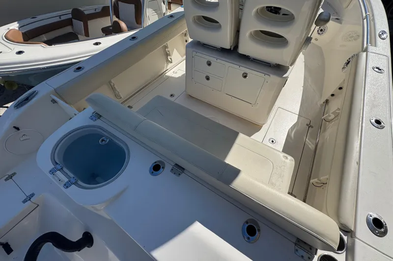 Slide: The Image of 2021 Cobia 262 Center Console boat interior with seating and storage compartments. - 6