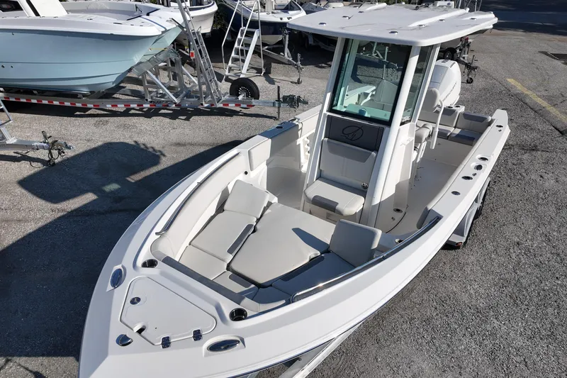 Slide: The Image of 2026 Sailfish 232 CC boat with sleek design and spacious seating on display. - 10