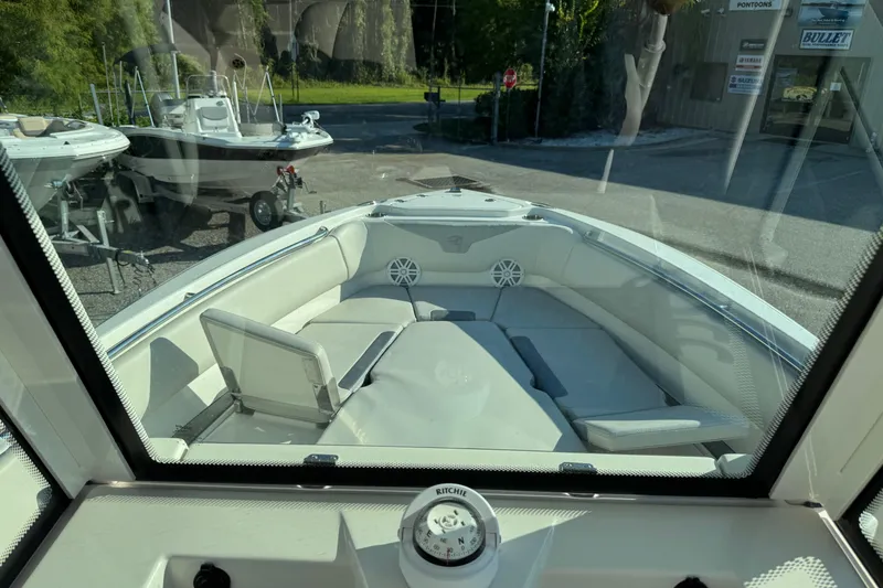 Slide: The Image of 2026 Sailfish 232 CC boat interior with cushioned seating and modern design. - 15